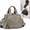 Bolsa de Mão de Tecido de Nylon Impermeável Transfronteiriça Nova Casual Leve Grande Capacidade Bolsa Transversal Bolsa de Ombro para Viagem ao Ar Livre