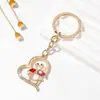 Moda Precioso Encantador Hueco Corazón de Amor Forma de Animal Llavero Colgante Accesorios para Mujeres Decoración para Llevar