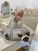 Bolso de Mano Pequeño Plateado Transfronterizo para Mujer 2026 Nuevo Estilo de Nicho Moda Coreana Bolso de Hombro Versátil Bolso Cruzado Simple