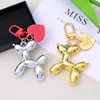 Estilo Ins Perro Globo Color Caramelo Colgante Llavero Metal Amor Estuche para Auriculares Colgante de Bolso Accesorios para Pareja