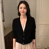 Suéter de cachemira para mujer con cuello en V, nuevo suéter color block de otoño e invierno, top de corte holgado, chaqueta de punto de manga larga, moderna imitación de dos piezas
