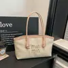 Bolso de hombro de paja tejido de alta costura, gran capacidad, moda versátil de primavera 2026, texturizado chic, simple