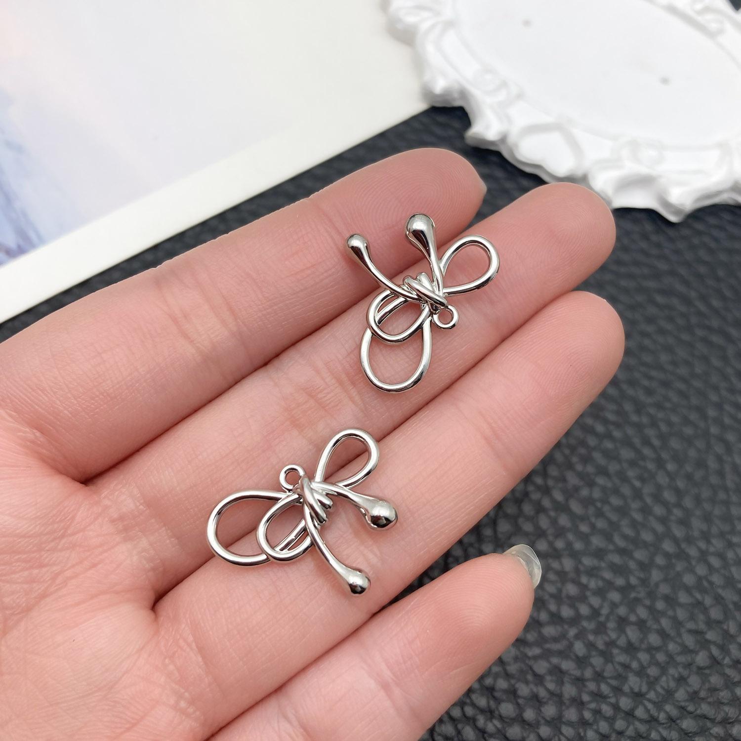 21405-DL-白k保色锌合金缠绕蝴蝶结17x21mm-1