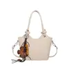 Bolso pequeño de moda de verano para mujer, nuevo estilo 2026, bolso tipo cubo con patrón tejido simple, bolso de hombro y bolso cruzado versátil