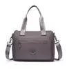 2026 de alta gama, moda nicho, bolso de hombro versátil, color sólido, bolso tote simple, bolso de mano de moda versátil