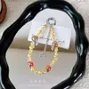 Correa de cadena para teléfono con cuentas de cristal, colgante de estrella colorida del cielo estrellado, cadena para colgar el teléfono, accesorio popular para bolso, pequeño regalo