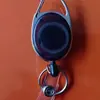 Llavero de cuero Oval transparente de color sólido retráctil con mosquetón de clip trasero hebilla de fácil extracción tirador en stock