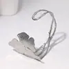 Pulsera de Acero Inoxidable Más Vendida Transfronteriza con Exquisito Diseño de Flor de Ginkgo, Joyería de Pulsera de Acero de Titanio de Lujo Ligero 18K de Alta Gama