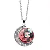 Cazador de demonios: Kimetsu No Yaiba Kamado Nezuko Collar de Luna Giratoria Periférico de Anime Colgante Giratorio de Doble Cara Cadena para Suéter