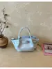 Bolso de cubo de mano transfronterizo súper caliente y elegante para mujer 2026 nueva tendencia moda bolso cruzado bolso tote pequeño para ir al trabajo moderno