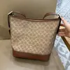Bolso de Mujer Ole 2025 Nuevo Bolso Cubo Firma Jude Bolso de Hombro Hobo Clásico Bolso de Axila
