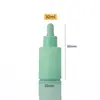 Botella dispensadora de vidrio esmerilado con punta de cuentagotas, Botella de muestra de esencia con logotipo impreso, Botella de aceite esencial colorida de hombro plano