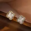 Pendientes de Plata de Ley 999 Flor Roja de Cuatro Hojas para Mujer Modelo Popular Nuevo 2026 Pendientes de Botón Ligeros de Lujo de Gama Alta Amigables con los Oídos