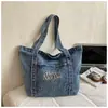 Bolsa de mezclilla vintage para mujer, adecuada para el trabajo y los desplazamientos, bolsa de un solo hombro artística, moderna, casual, elegante y bolso grande único