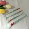 Set de brochas de maquillaje de cuatro piezas con cola de pez, mango de cristal, cerdas suaves, herramientas de belleza brillantes, láser, disponible para venta al por mayor