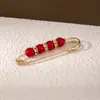 Colorido pasador de cintura con perlas y diamantes para ajustar la talla de la cintura de la ropa, accesorio de broche anti-exposición