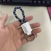 Llavero de cuerda tejida a mano de cuero para coche personalidad creativo colgante de llave patrón de texto imprimible venta al por mayor de fábrica