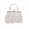 Yuezhi retro simple lujo ligero elegante 2026 primavera nuevo bolso de mano versátil con cadena de perlas para mujer con un toque de alta gama