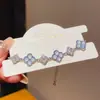 Pulsera de trébol de cuatro hojas de circón para mujer, joyería floral de diseño de nicho de lujo ligero, pulsera de temperamento de moda de alta gama