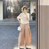 Conjunto de verano: un conjunto completo de tops de manga corta y pantalones de pierna ancha 2026, un estilo relajado y casual, un traje atractivo para mujer