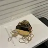 Bolsa para Auriculares 2025 Nuevo Modelo Moda Europea y Americana Brillante de un Solo Hombro para Mujer Cruzada Mini Bolsa Caja de Acrílico Moderna