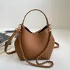 Bolsa de mão com textura de tendência transfronteiriça, bolsa tipo balde, bolsa feminina, novo verão 2026, cor sólida, corrente, bolsa de ombro único, bolsa tiracolo mãe-filho