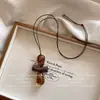 Colar com Pingente de Madeira Longo Irregular Vazado Retrô para Mulheres Corrente Longa para Suéter de Design de Nicho Fashion de Alta Qualidade
