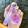 Llavero creativo de aceite de rosa lindo con arena movediza líquida pequeño colgante accesorios para bolso amantes pequeños regalos al por mayor