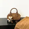 Outono/Inverno 2026 Novo Estilo Feminino Ins Celebridade da Internet Mesmo Estilo Fashionável Versátil Horizontal Pequena Bolsa de Mão Bolsa de Boliche Pequena Bolsa