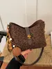 Bolso de mano de diseño nicho estilo coreano transfronterizo para mujer, moderno, simple, color liso, texturizado, elegante, bandolera y de hombro vintage