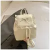 Mochila de lunares de nicho para chica dulce, nueva tendencia primavera 2026, elegante para ir al trabajo, casual, mochila pequeña para la escuela