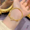 Tienda de oro con pulsera de mariposa azul quemada en arena dorada pulsera de ojo de gato bola de seda exquisita joyería de diseño de nicho para mujer