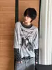 Exclusivo para ventas transfronterizas: Camiseta estampada a rayas patchwork de diseño estilo americano, dos piezas falsas, top casual versátil holgado para hombre