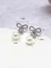 Brincos de Pérola Grandes JUSTOP Temperamento Gentil Sensação de Alta Classe Brinco para Mulheres Cravejado com Strass Brinco de Laço Moderno Criativo
