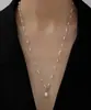 Collar largo con hebilla 0T de perlas de imitación de moda europea y americana, colgante de perlas de agua dulce barrocas, cadena de suéter femenina