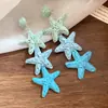 Pendientes de borla de estrella degradada de rafia con aguja plateada estilo vacaciones en la playa pendientes exagerados pendientes de lujo ligero de alta gama para mujer