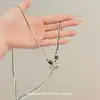 Collar Colgante de Elefante Pequeño Estilo Étnico para Mujer Modelo Nuevo 2026 Cadena de Suéter Estilo Chino Nuevo Accesorio de Cuello Simple y Elegante para Sudadera