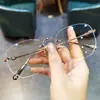Novos Armações de Óculos em Formato de Coração Jian Dan Luo para Homens e Mulheres, Armação de Titânio Tendência, Ultraleve, Sem Aro, Armação Perfurada, Podem Ser Equipados com Lentes de Grau e Proteção Contra Luz Azul