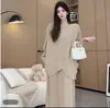 Elegante conjunto de otoño de alta calidad para comercio exterior, top irregular de manga larga tipo murciélago, conjunto de dos piezas para mujer adelgazante y elegante