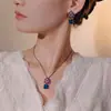 Otoño e Invierno Nuevo Joyería Huabi Base de Cobre Chapado en Oro Espinela Azul Simulada Oro Negro Conjunto Retro de Camelia 10*10