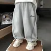 Calça de moletom infantil outono calça esportiva infantil 2026 nova calça casual primavera e outono para crianças pequenas e médias calça afunilada solta