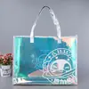 Fornecimento direto da fábrica laser PVC bolsa requintada bolsa de presente mágica compras TPU bolsa de mão laser atacado