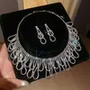 Aretes y collar de dos piezas con colgante de flor y gota de agua incrustados con diamantes, cadena para la clavícula de moda y exquisita, joyería de lujo ligero y de alta gama para mujer