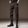 Pantalones de trabajo multi-bolsillo texturizados de algodón de fibra larga de alta densidad para hombre, corte holgado retro, color café, pantalones casuales funcionales tácticos de alta calle