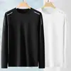 Camiseta elástica de manga larga para hombre, corte holgado, adecuada para primavera y otoño, color liso, versátil, se puede usar como atuendo de pareja, capa interior para hombre