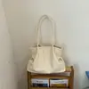 Bolso de hombro casual personalizado de moda 2026 nuevo estilo de verano bolso moderno para el trabajo y los desplazamientos bolso tote de color liso para mujer
