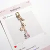 Crema de Manos de Dibujos Animados Linda, Protector Solar, Llavero, Colgante para Bolso, Pequeño Regalo Decorativo, Accesorios Colgantes para Bolsos de Pareja Multicolor