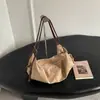 Bolsa tipo dumpling diseño nicho coreano bolsa de gamuza esmerilada, nueva bolsa de hombro único cruzada para axila retro de otoño e invierno para commuting