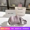 Entrega en una sola pieza otoño e invierno bolso de axila de alta calidad 2023 nuevo bolso cubo con cadena de perlas al por mayor