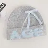 Gorro estilo coreano con lazo para mujer, nuevo modelo 2026, gorro de lana tejido con orejeras, adecuado para ciclismo, cálido, lindo y a prueba de viento